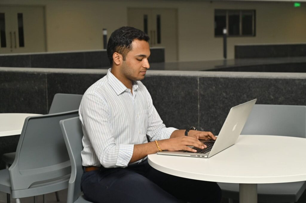 Research professional working on laptop at IITB Research Park Powai Mumbai